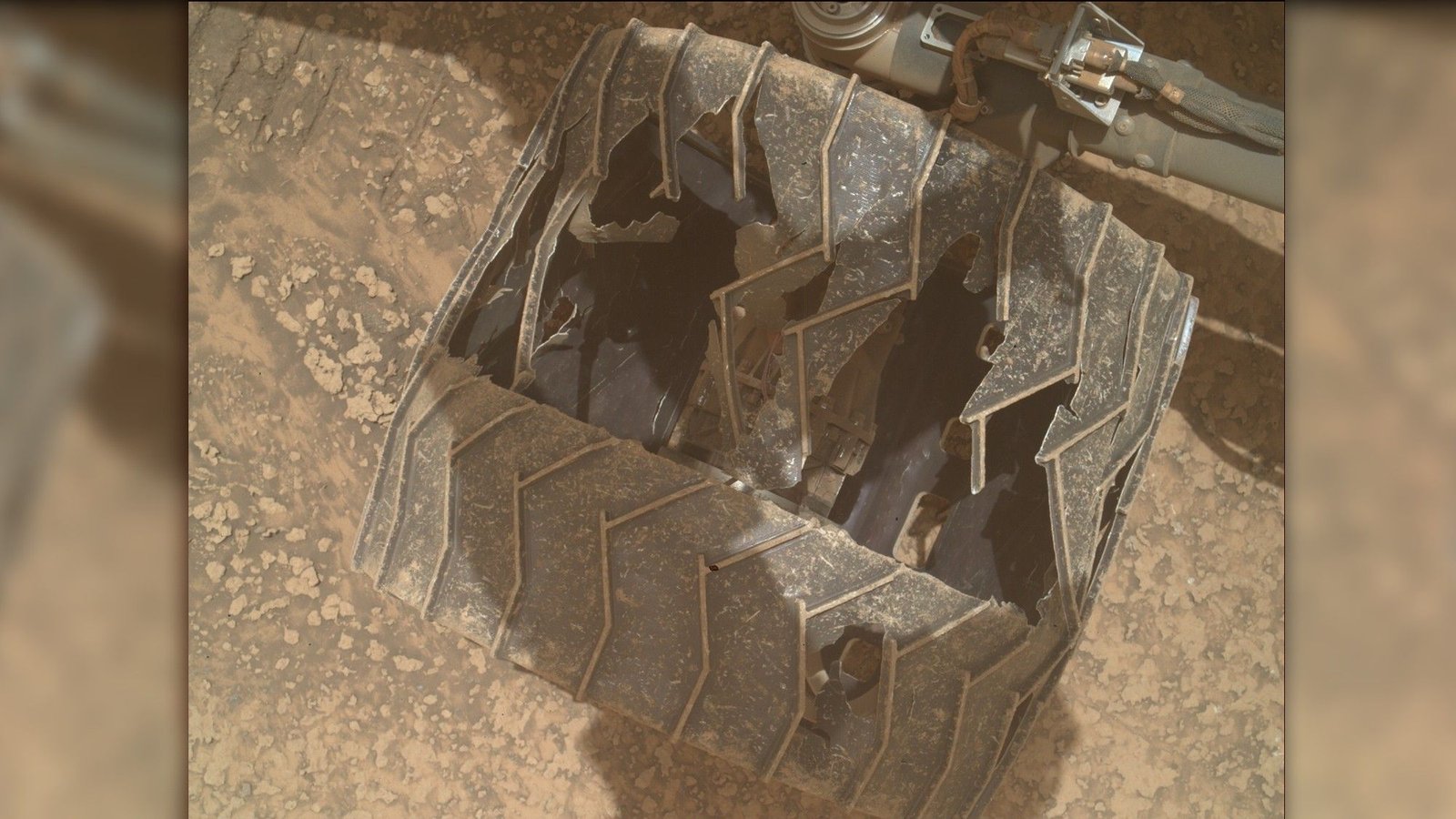 Curiosity Mars rover inspects cracked wheel photo of the day for July 27, 2026